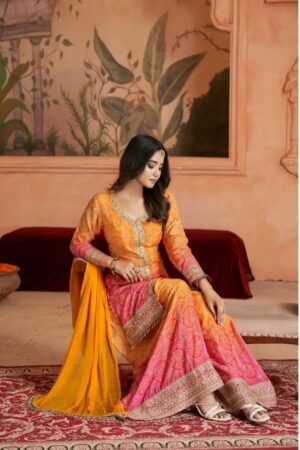 Exquisite Orange and Pink Sharara Suit with Intricate Detailing sitting view