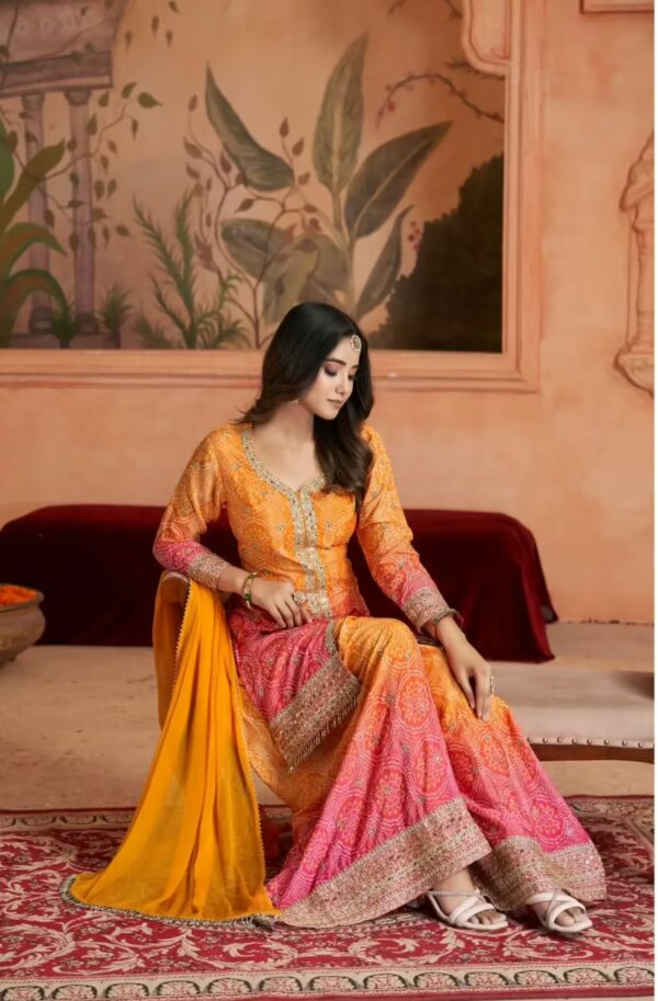 Exquisite Orange and Pink Sharara Suit with Intricate Detailing sitting view